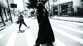 Gisele Marie, a Muslim woman and professional heavy metal musician, crosses a street after a rehearsal at a studio in Sao Paulo September 15, 2015. Based in Sao Paulo, Marie, 42, is the granddaughter of German Catholics, and converted to Islam several months after her father passed away in 2009. Marie, who wears the Burka, has been fronting her brothers' heavy metal band 